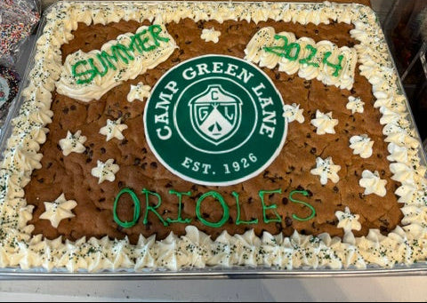 Cookie Cake with Green and White icing and camp logo