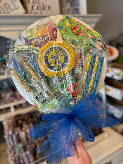 An assortment of candy treats on a round board